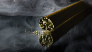 Cannabis Blunt on a smoky background