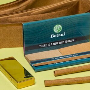 Botani Gummed Wrap for Blunts next to Hemp paper, gold lighter and rolled blunts